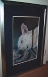 Framed pastel portrait of a white dog